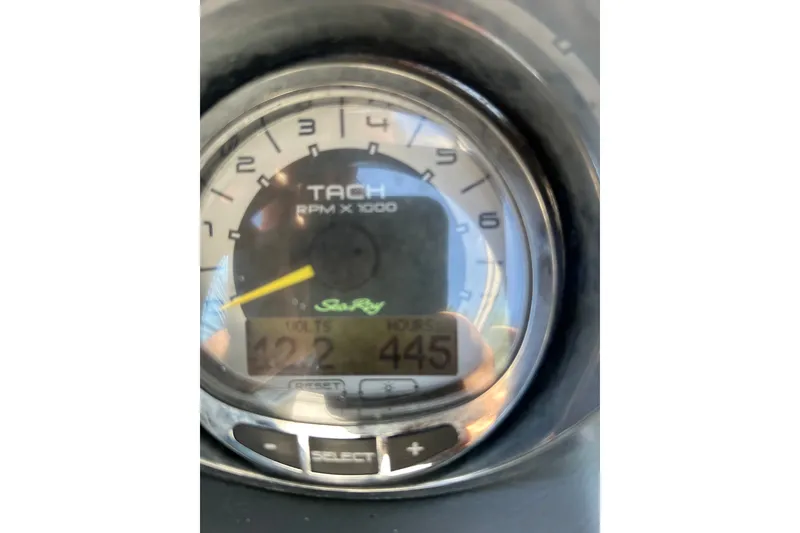 Slide: The Image of Close-up of 2010 Sea Ray 260 Sundeck tachometer displaying RPM and voltage. - 27