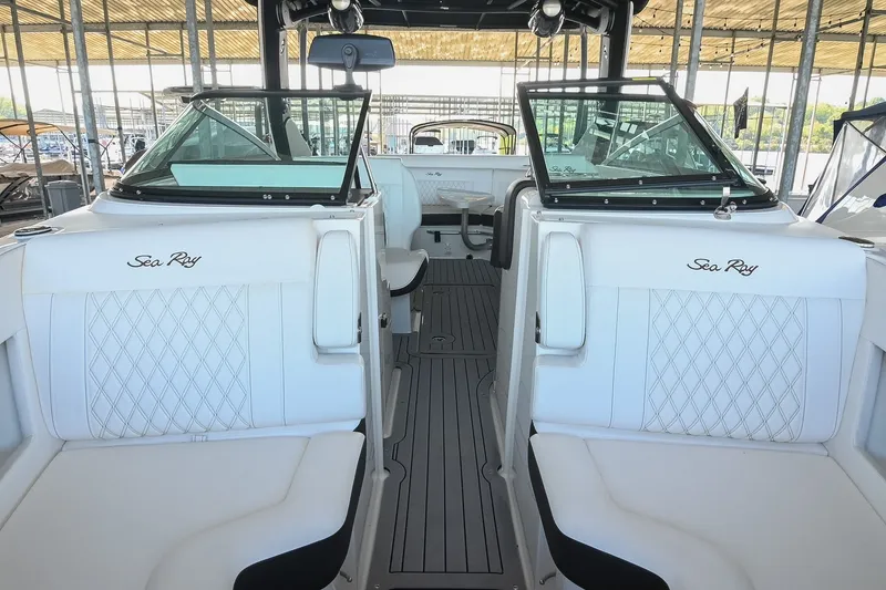 Slide: The Image of 2019 Sea Ray SLX 280 boat interior with white seating and elegant design. - 35