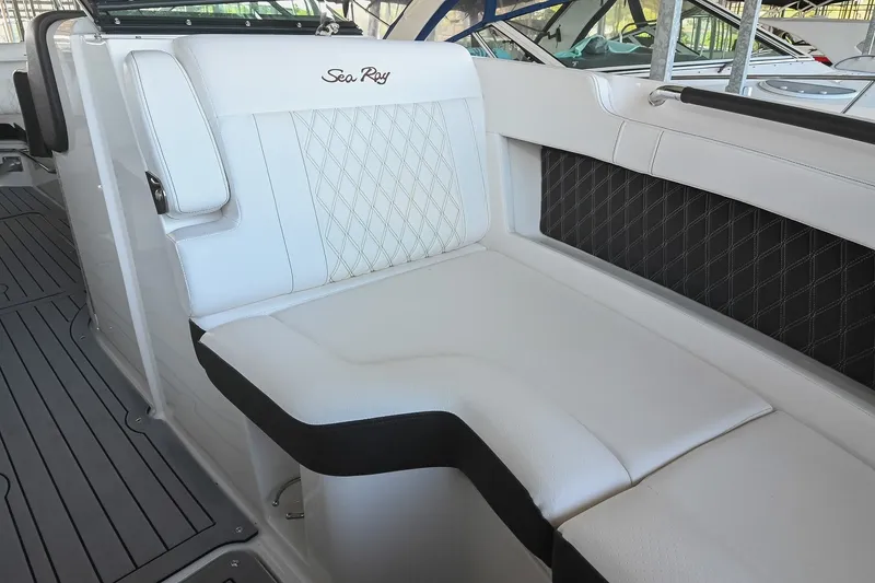 Slide: The Image of Luxurious seating on a 2019 Sea Ray SLX 280 boat with elegant white upholstery. - 33