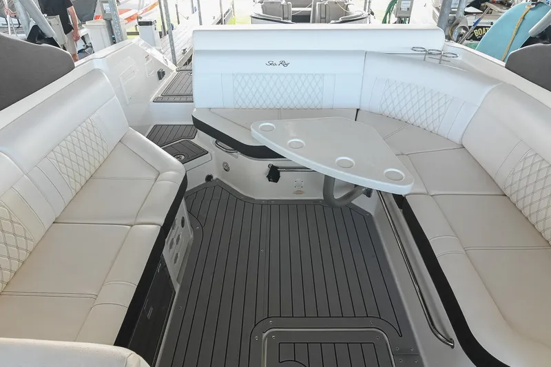 Slide: The Image of Luxurious interior of 2019 Sea Ray SLX 280 boat with elegant seating and table. - 16