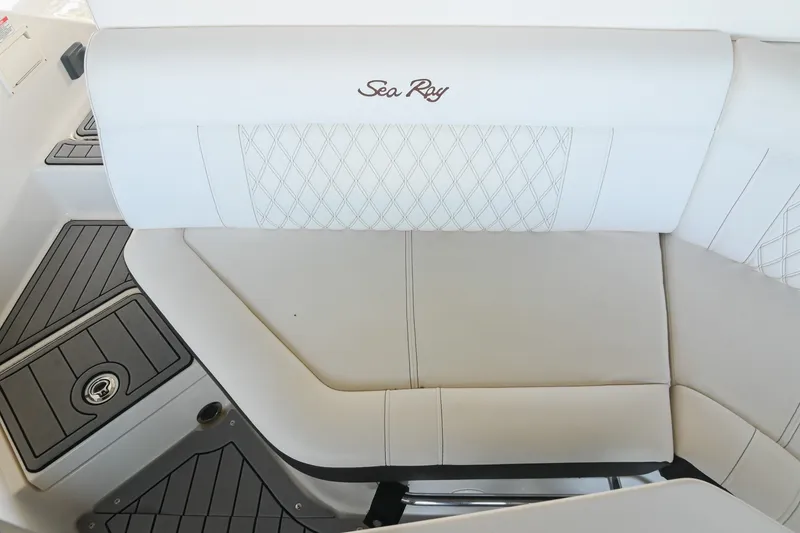 Slide: The Image of 2019 Sea Ray SLX 280 boat interior with white cushioned seating and elegant design. - 18