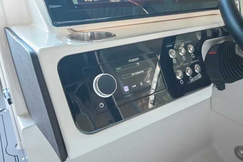 Slide: The Image of Control panel of 2019 Sea Ray SLX 280 boat with audio system and switches. - 28