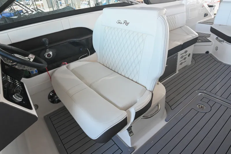 Slide: The Image of 2019 Sea Ray SLX 280 boat interior with luxurious white seating and modern dashboard. - 29