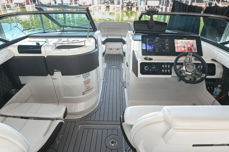 Slide: The Image of 2019 Sea Ray SLX 280 boat interior with modern dashboard and seating. - 22