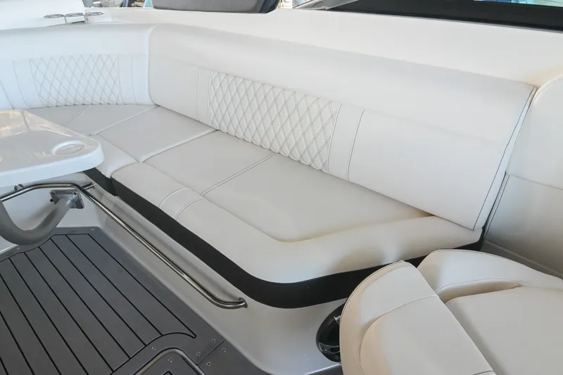 Slide: The Image of Luxurious seating on 2019 Sea Ray SLX 280 boat with elegant white upholstery. - 19