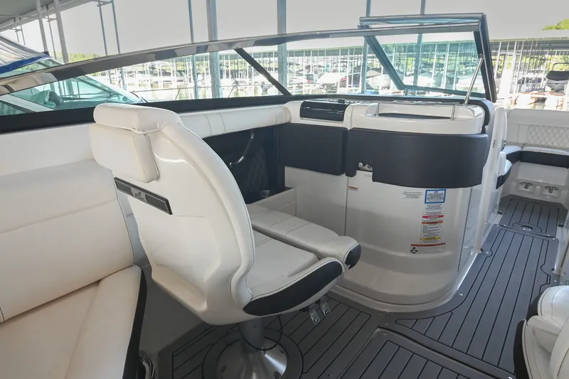 Slide: The Image of Interior of 2019 Sea Ray SLX 280 boat with sleek seating and modern dashboard. - 23