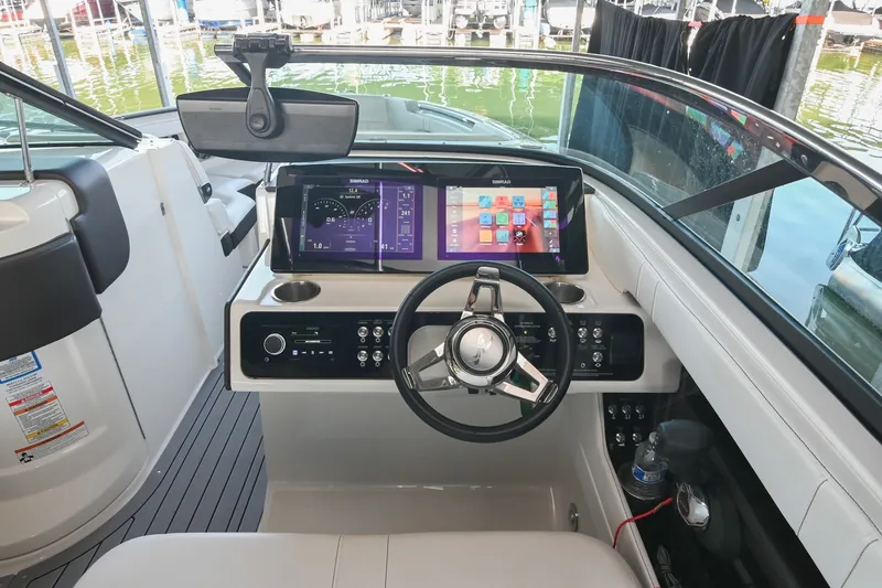 Slide: The Image of 2019 Sea Ray SLX 280 helm with modern controls and touchscreen display. - 26