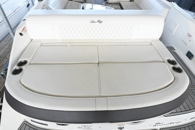 Slide: The Image of 2019 Sea Ray SLX 280 boat with spacious rear seating and cup holders. - 14