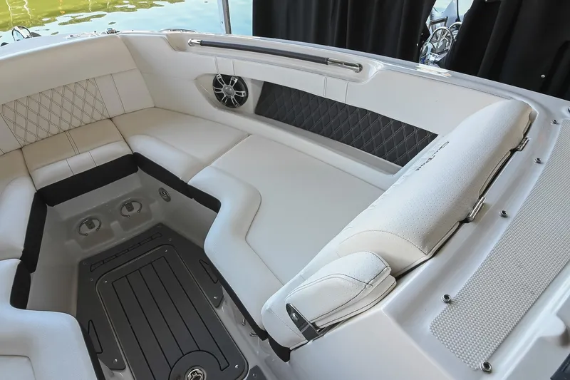 Slide: The Image of Luxurious seating area on a 2019 Sea Ray SLX 280 boat, featuring elegant upholstery. - 32