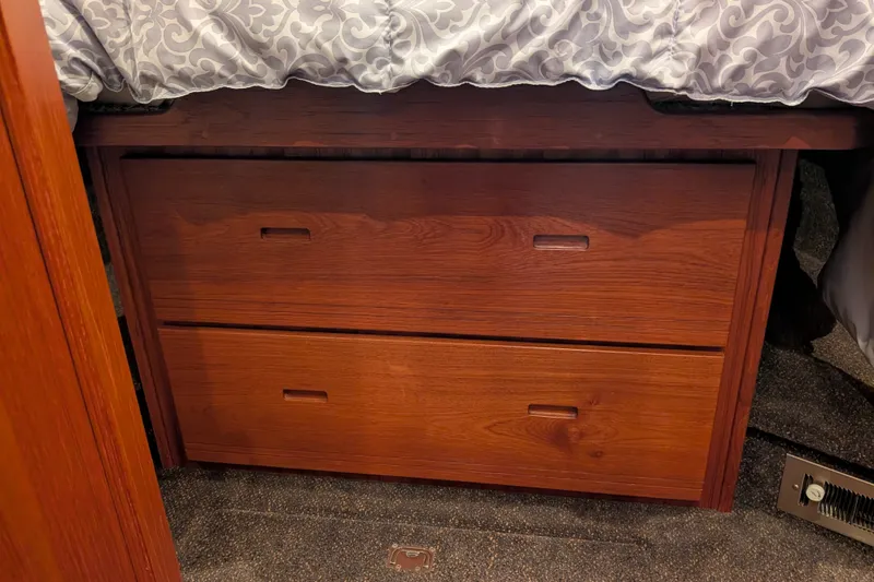 Slide: The Image of Wooden drawers under bed in 2003 Nordic Tug 37 boat cabin. - 44
