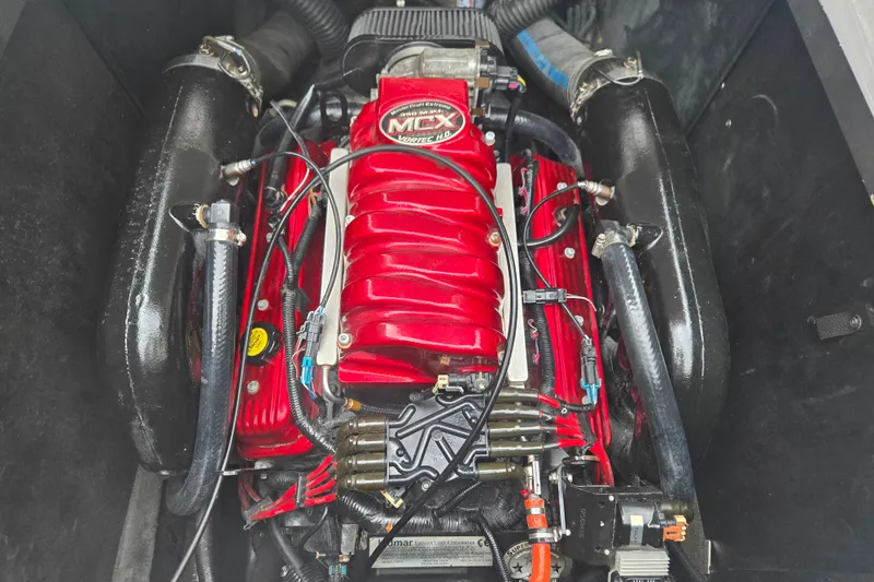 Slide: The Image of 2008 MasterCraft X-35 engine, featuring a red MCX Vortec power unit with black components. - 7