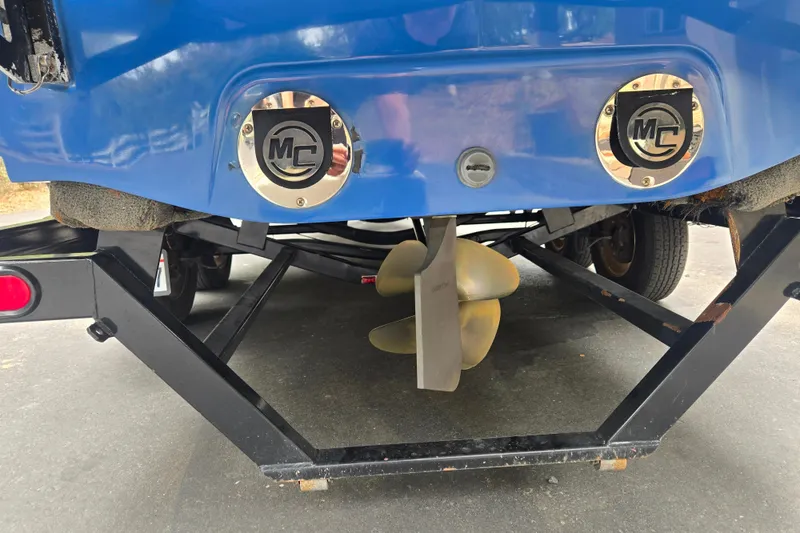 Slide: The Image of Rear view of a 2008 MasterCraft X-35 boat on a trailer, showcasing propeller and exhaust. - 4