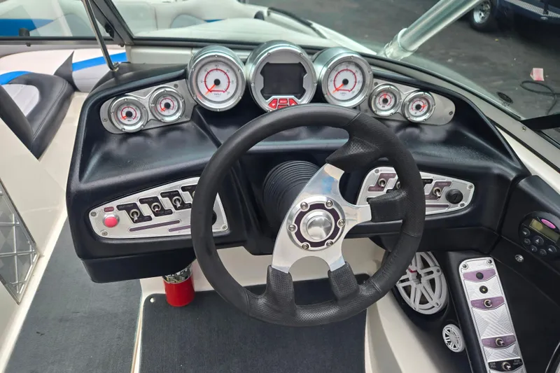 Slide: The Image of 2008 MasterCraft X-35 boat dashboard with steering wheel and gauges. - 8