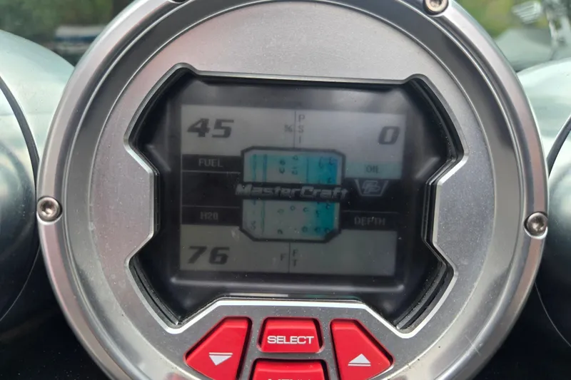 Slide: The Image of Close-up of 2008 MasterCraft X-35 dashboard display with digital gauges and controls. - 9