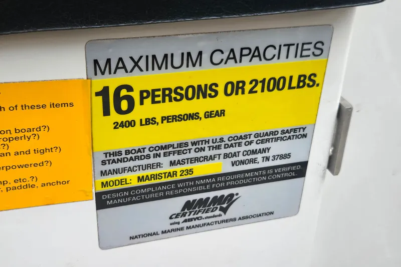 Slide: The Image of 2008 MasterCraft X-35 capacity label: 16 persons or 2100 lbs, compliant with safety standards. - 13