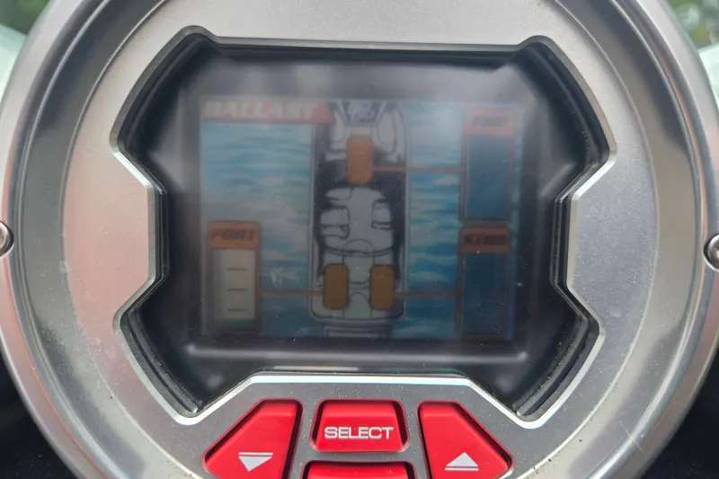 Slide: The Image of Close-up of a 2008 MasterCraft X-35 boat control panel display. - 10