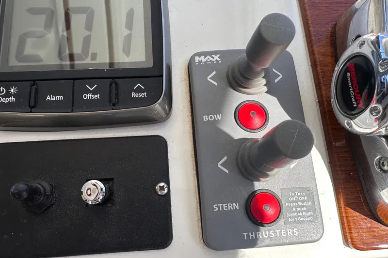 Slide: The Image of Control panel of a 2011 Beneteau Swift Trawler 34 with thruster controls and display. - 52
