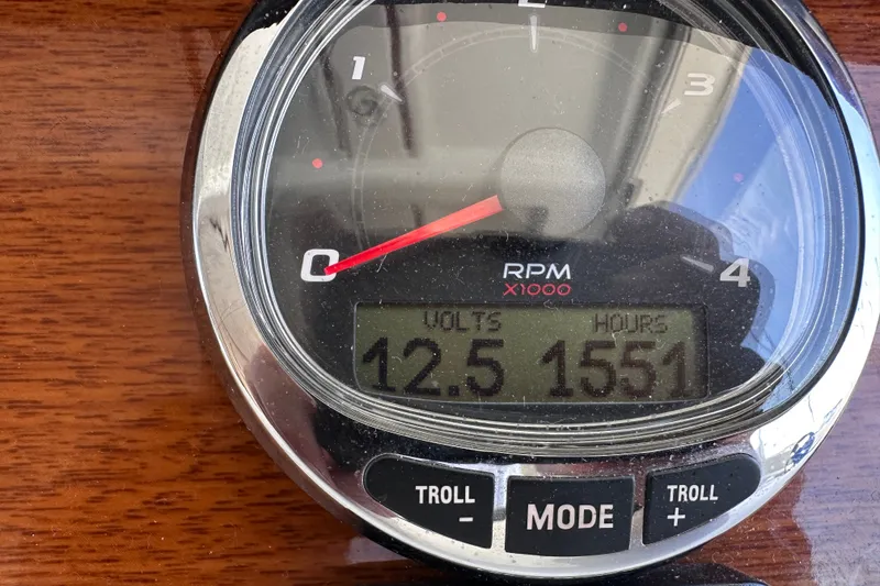 Slide: The Image of Close-up of Beneteau Swift Trawler 34 tachometer showing 12.5 volts and 1551 hours. - 77
