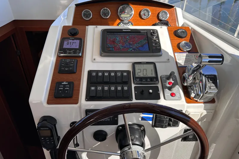Slide: The Image of Helm of 2011 Beneteau Swift Trawler 34 with navigation instruments and controls. - 46