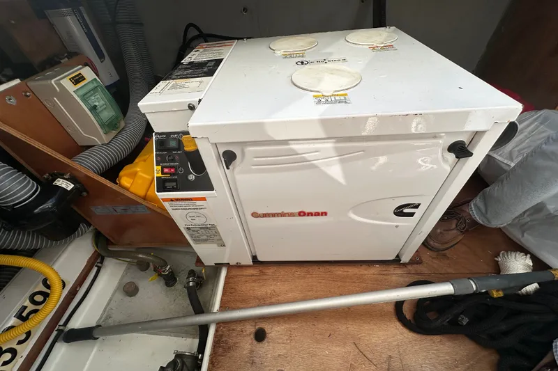 Slide: The Image of Cummins Onan generator in a 2011 Beneteau Swift Trawler 34 engine room. - 74