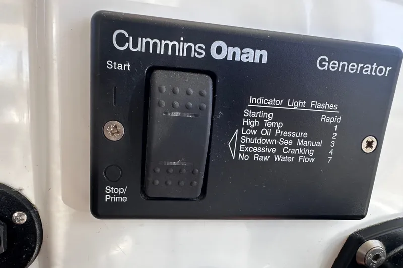 Slide: The Image of Cummins Onan generator control panel on 2011 Beneteau Swift Trawler 34. - 54