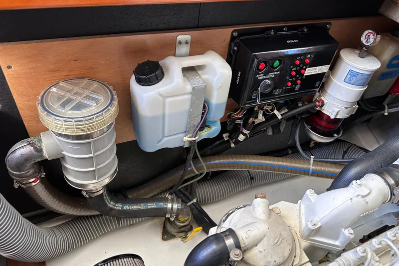 Slide: The Image of Engine room of 2011 Beneteau Swift Trawler 34, showcasing mechanical components and wiring. - 70