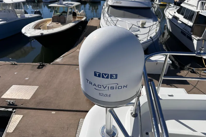 Slide: The Image of Satellite TV antenna on a 2011 Beneteau Swift Trawler 34 at a marina. - 31