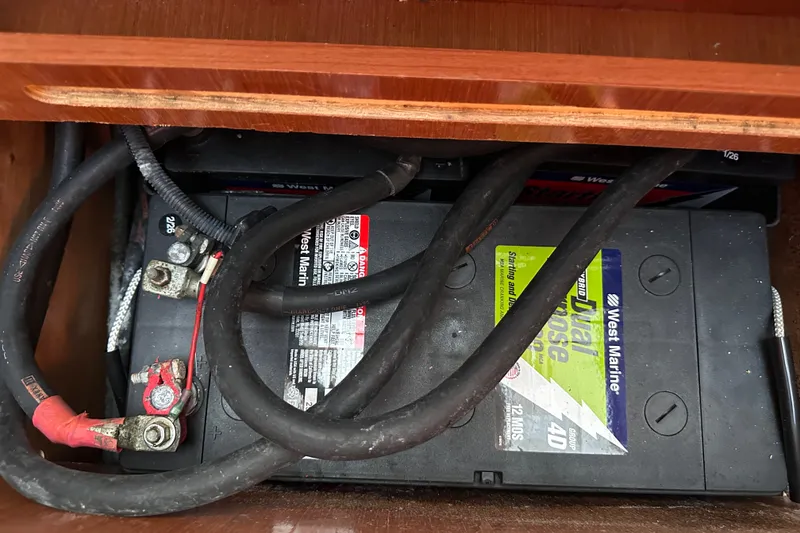 Slide: The Image of Battery compartment of a 2011 Beneteau Swift Trawler 34 with cables and connections. - 63