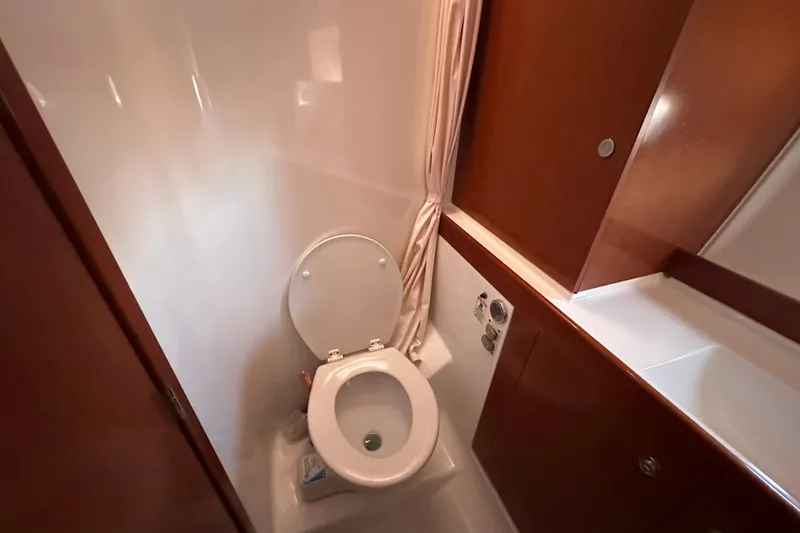 Slide: The Image of Bathroom interior of 2011 Beneteau Swift Trawler 34 with wooden cabinetry. - 61