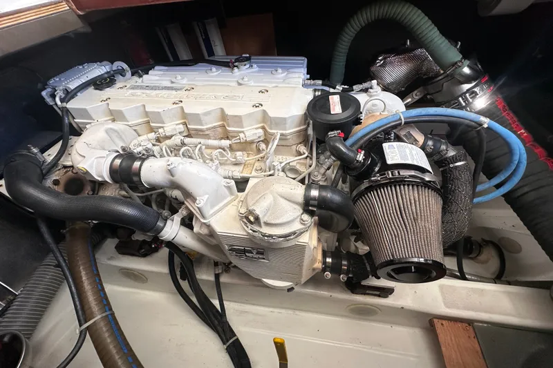 Slide: The Image of Engine compartment of a 2011 Beneteau Swift Trawler 34, showcasing detailed mechanical components. - 68