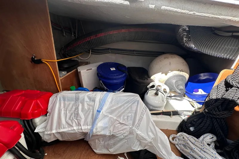 Slide: The Image of Storage area of a 2011 Beneteau Swift Trawler 34 with equipment and supplies. - 76