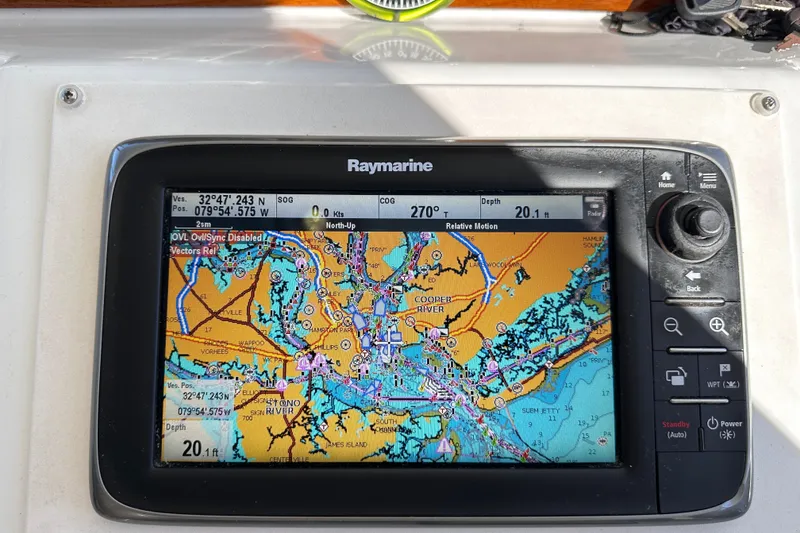 Slide: The Image of Raymarine navigation display on 2011 Beneteau Swift Trawler 34, showing nautical chart and coordinates. - 47
