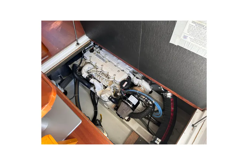 Slide: The Image of Engine compartment of 2011 Beneteau Swift Trawler 34, showcasing mechanical components. - 67