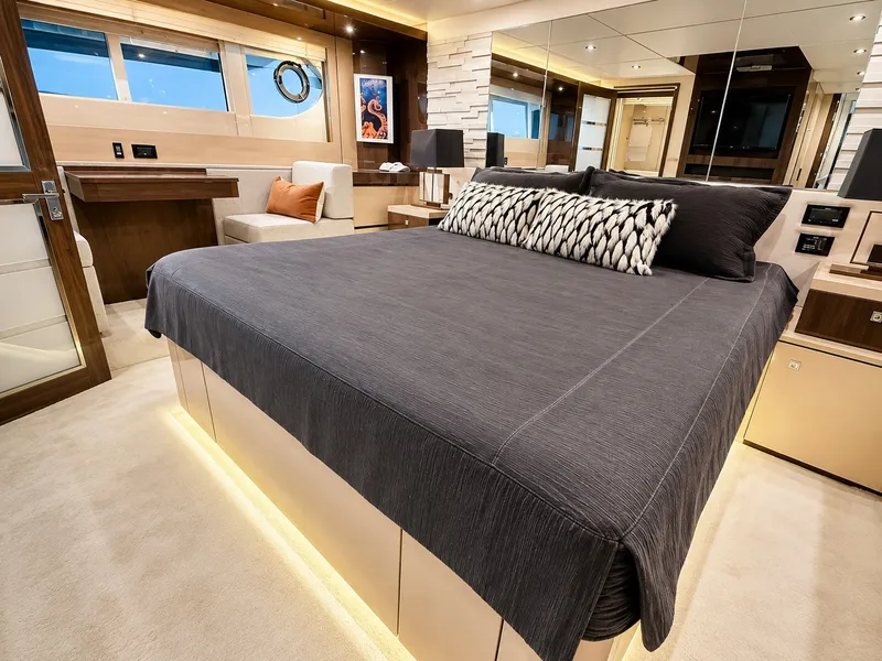 Slide: The Image of Luxurious cabin with a large bed, stylish lighting, and elegant decor on a Cruisers Yachts 60 Fly. - 28
