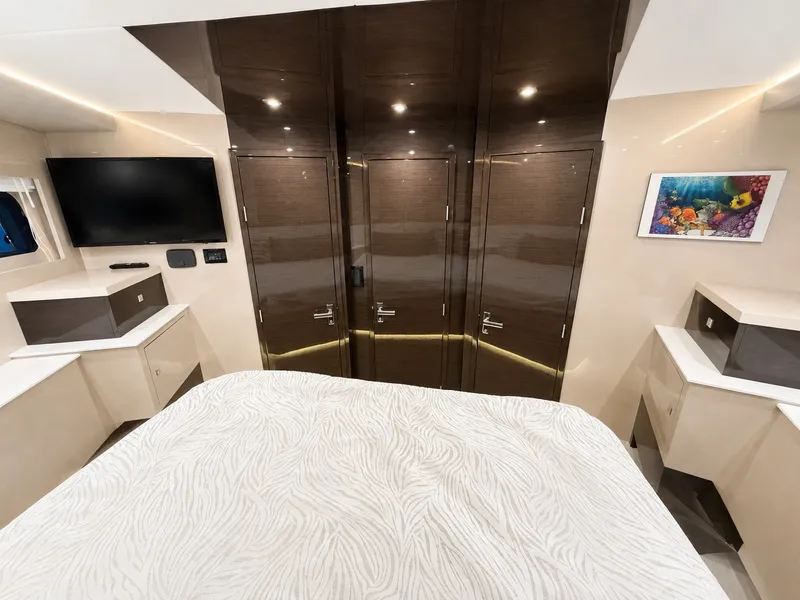 Slide: The Image of Luxurious cabin with modern design, flat-screen TV, and stylish cabinets aboard a Cruisers Yachts 60 Fly. - 39