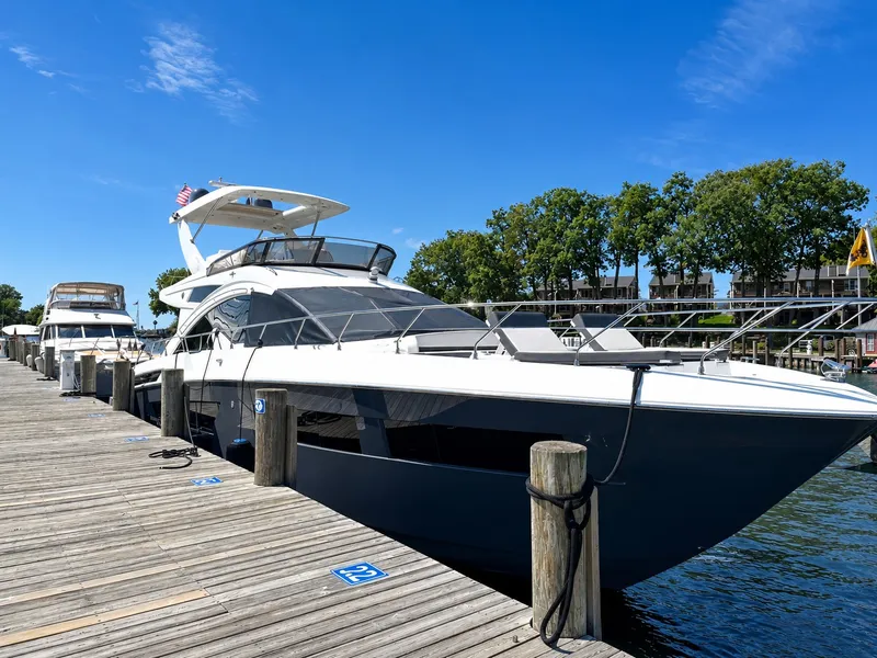 The Image of A 2019 Cruisers Yachts 60 Fly docked on a sunny day with clear skies. - 0
