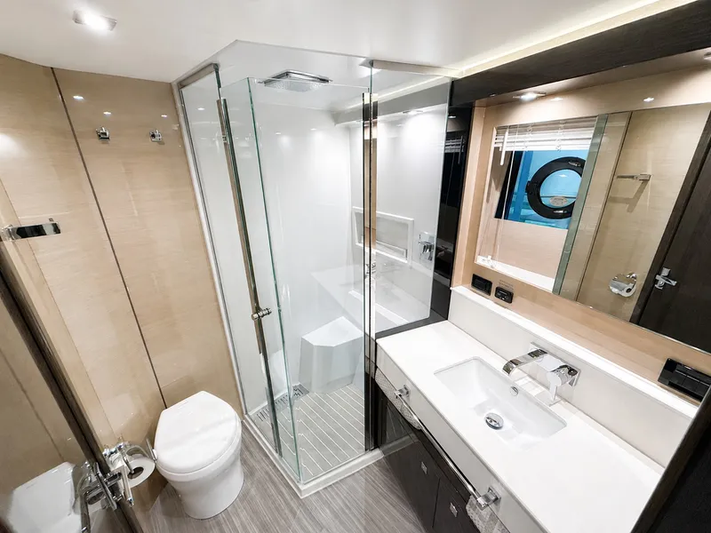 Slide: The Image of Modern bathroom with glass shower, sink, and toilet on a yacht. - 43