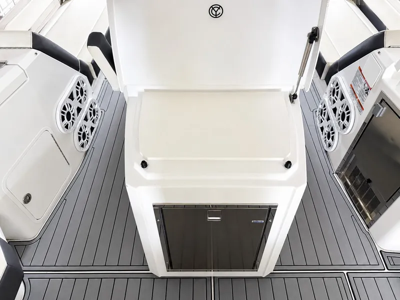 Slide: The Image of The 2019 Cruisers Yachts 60 Fly features a modern deck with speakers and storage. - 19