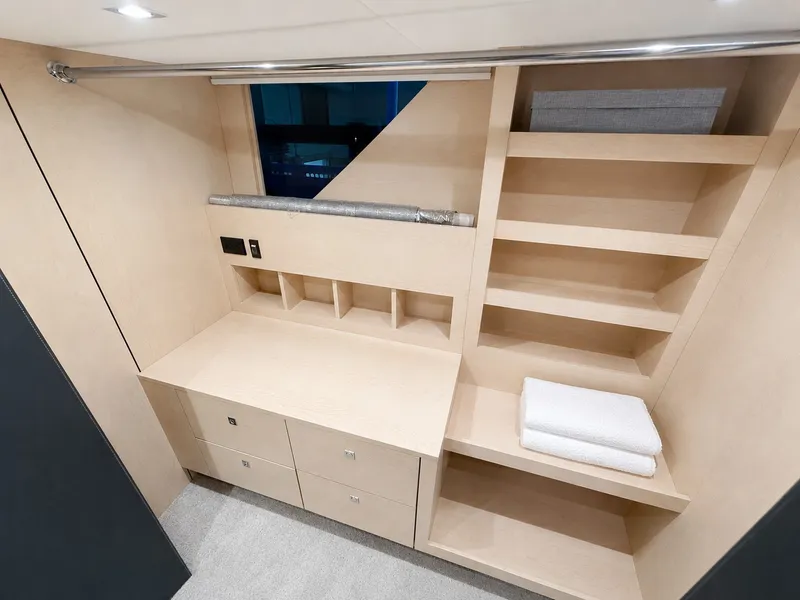 Slide: The Image of Interior of a 2019 Cruisers Yachts 60 Fly with cabinets and shelves. - 23