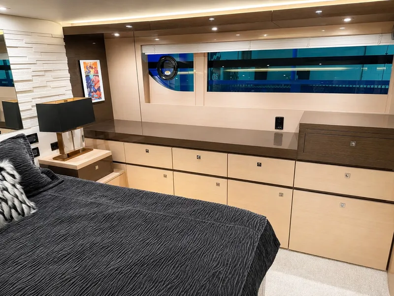 Slide: The Image of Luxurious cabin with modern design, large windows, and stylish furnishings on a Cruisers Yachts 60 Fly. - 25
