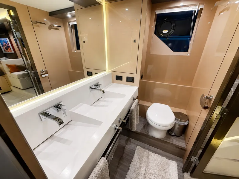 Slide: The Image of Luxurious bathroom with double sinks, toilet, and modern fixtures on a yacht. - 33