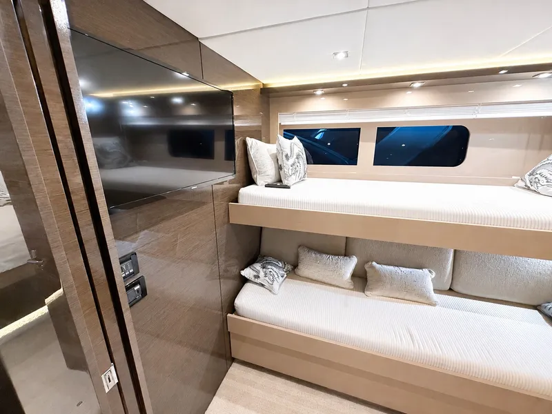 Slide: The Image of Interior of a luxury yacht with bunk beds and a large TV. - 41