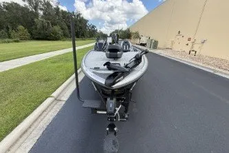 Slide: The Image of 2027 Nitro Z20 XL boat on a paved road near a grassy area. - 5