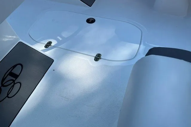 Slide: The Image of Interior view of a 2027 Tahoe T21 boat, featuring sleek white surfaces. - 14