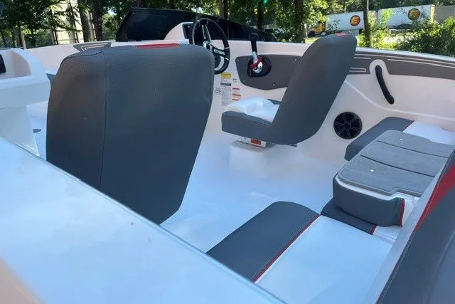 Slide: The Image of Interior of a 2027 Tahoe T21 boat with modern seating and steering wheel. - 7