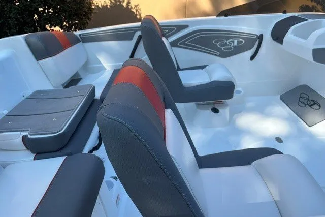 Slide: The Image of 2027 Tahoe T21 boat interior with gray and red seating, modern design. - 8