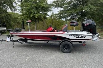 The Image of 2027 Nitro Z18 XL Pro boat with sleek design, parked outdoors on a trailer. - 0