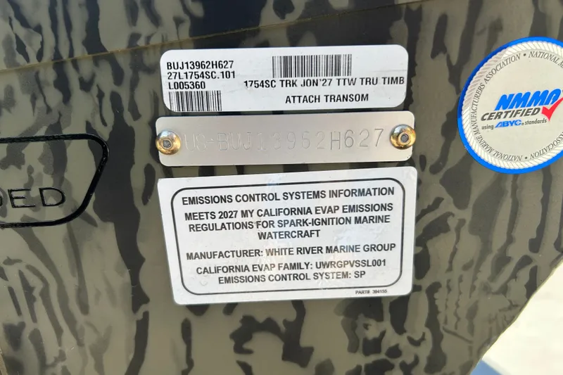 Slide: The Image of Sticker and plate details on a 2027 Tracker Grizzly 1754 SC boat. - 47