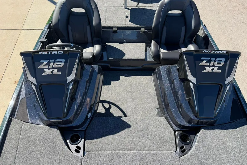 Slide: The Image of 2027 Nitro Z18 XL Pro boat interior with dual seats and steering console. - 18