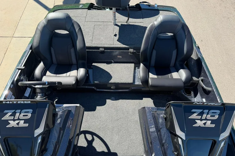 Slide: The Image of 2027 Nitro Z18 XL Pro boat interior with dual seats and steering console. - 22
